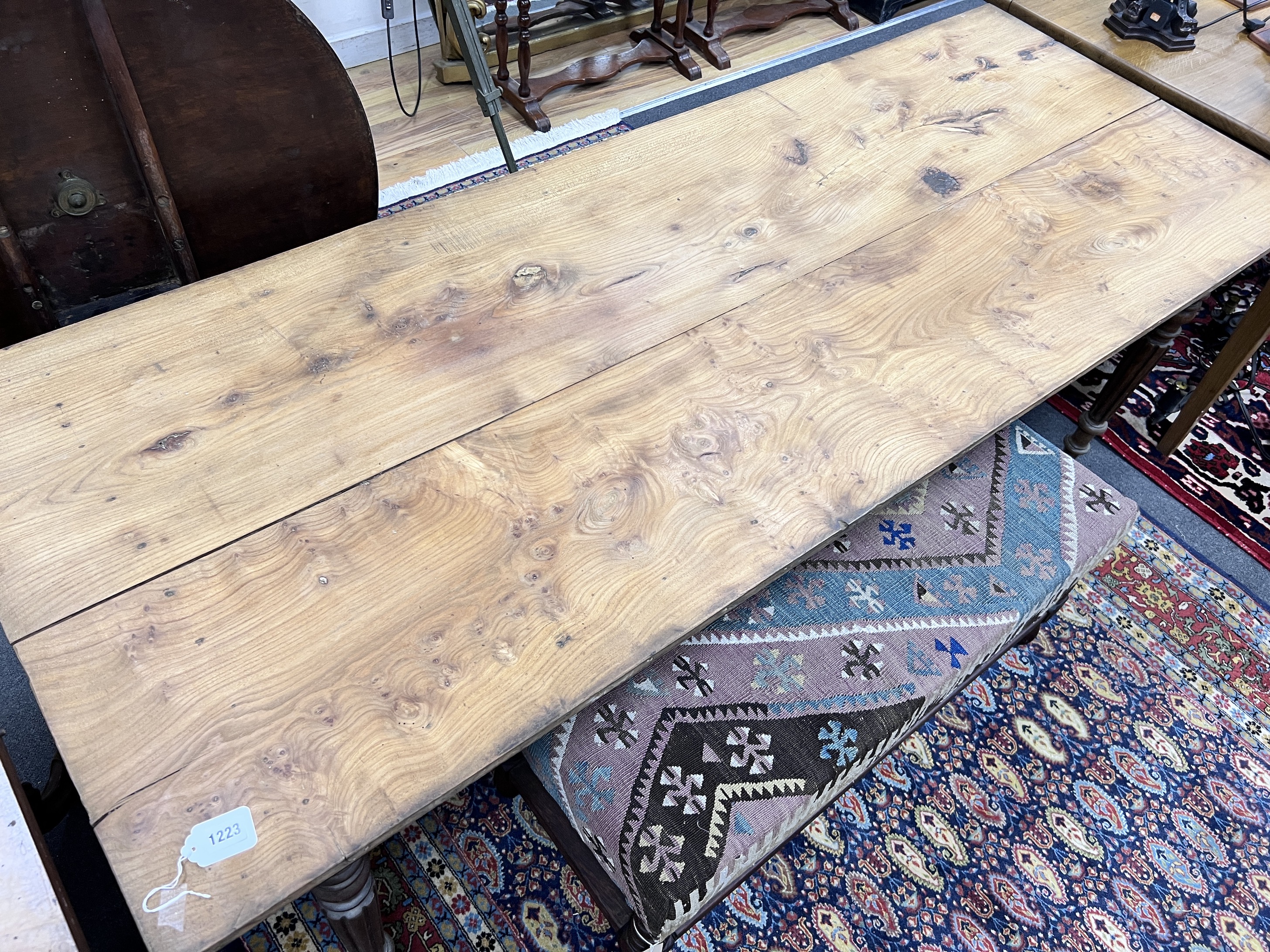 A 19th century French oak and fruitwood kitchen table, length 194cm, width 74.5cm